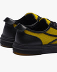Sneakers nere e gialle Untitled 75