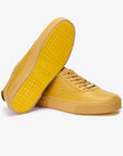Sneakers elegantes unisex doradas Gold 580
