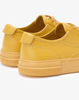 Sneakers elegantes unisex doradas Gold 580