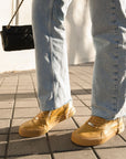Sneakers elegantes unisex doradas Gold 580